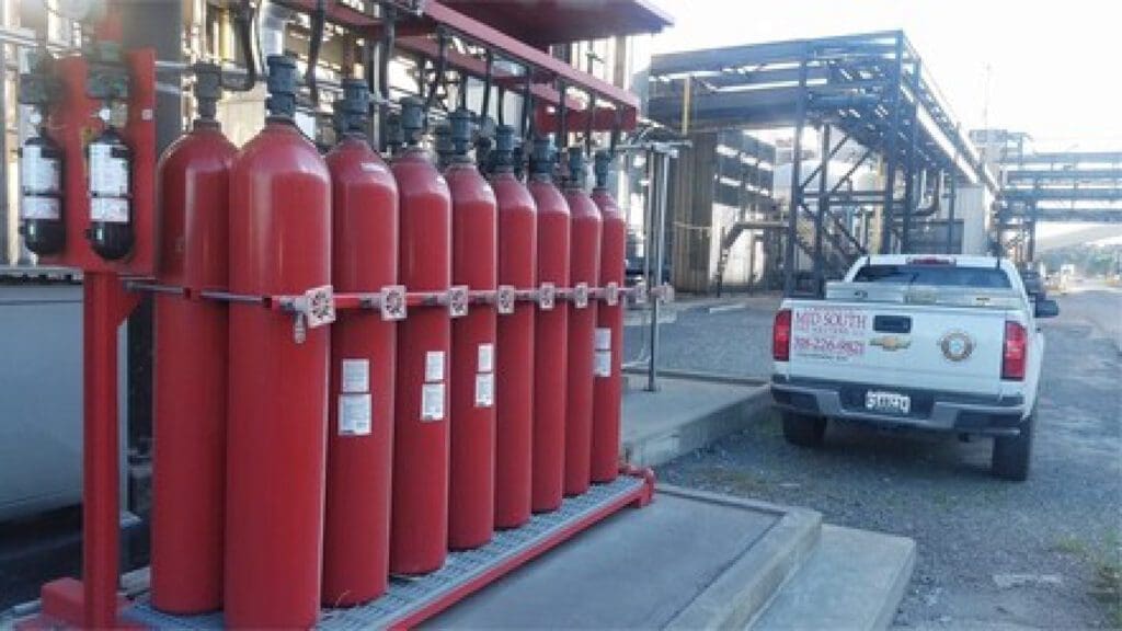 A Group of Red Cylinders on a Rack