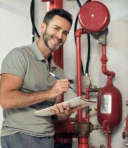 Engineer Checking Industrial Generator Fire Control System